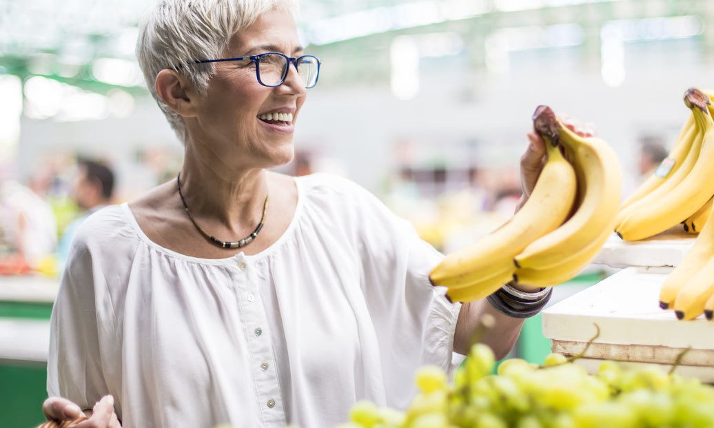 Buying bananas in a market