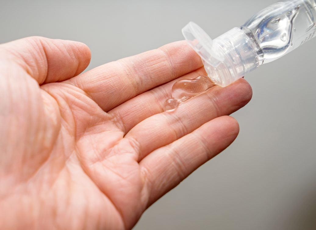 Hand sanitiser being applied to a hand.